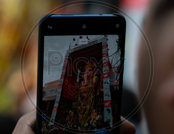 Man Capturing Khairatabad Ganesha Idol on Mobile or Smartphone