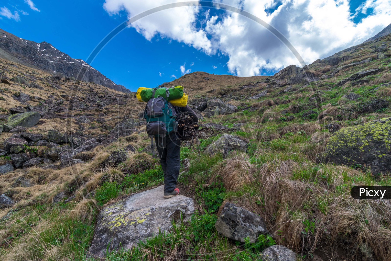 Tourist with backpack hiking the mountain range at Lahaul And Spiti