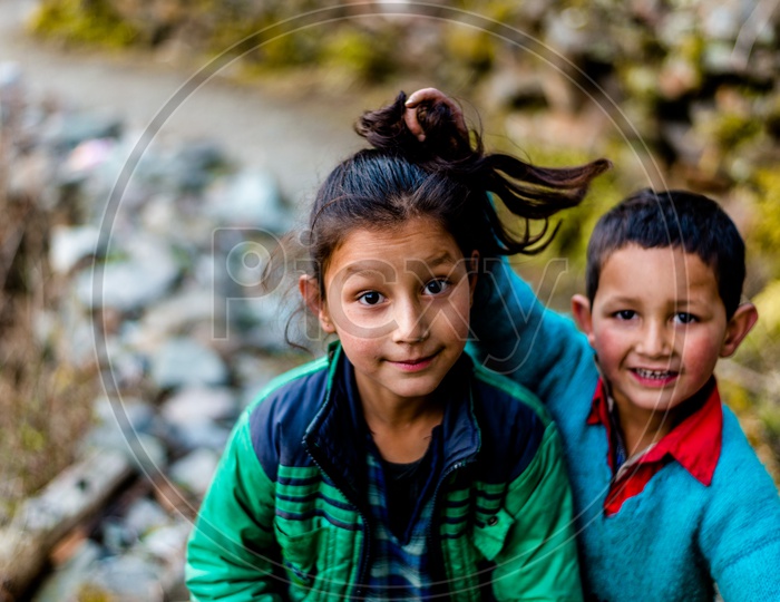 Portrait of Cute Himachali Brother playing with Sister