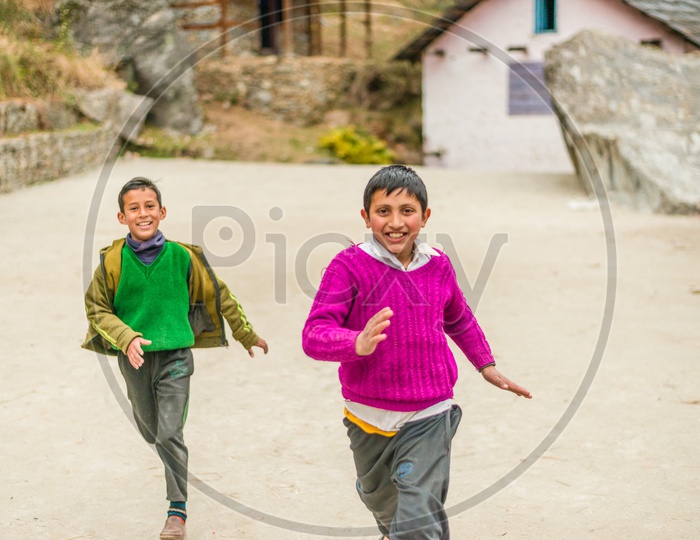 Himalayan Kids running on Street in Kullu Village