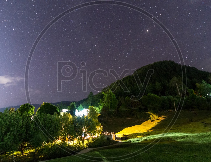 Night Landscape of a Rural Village with Stars in Sky, Stargazing