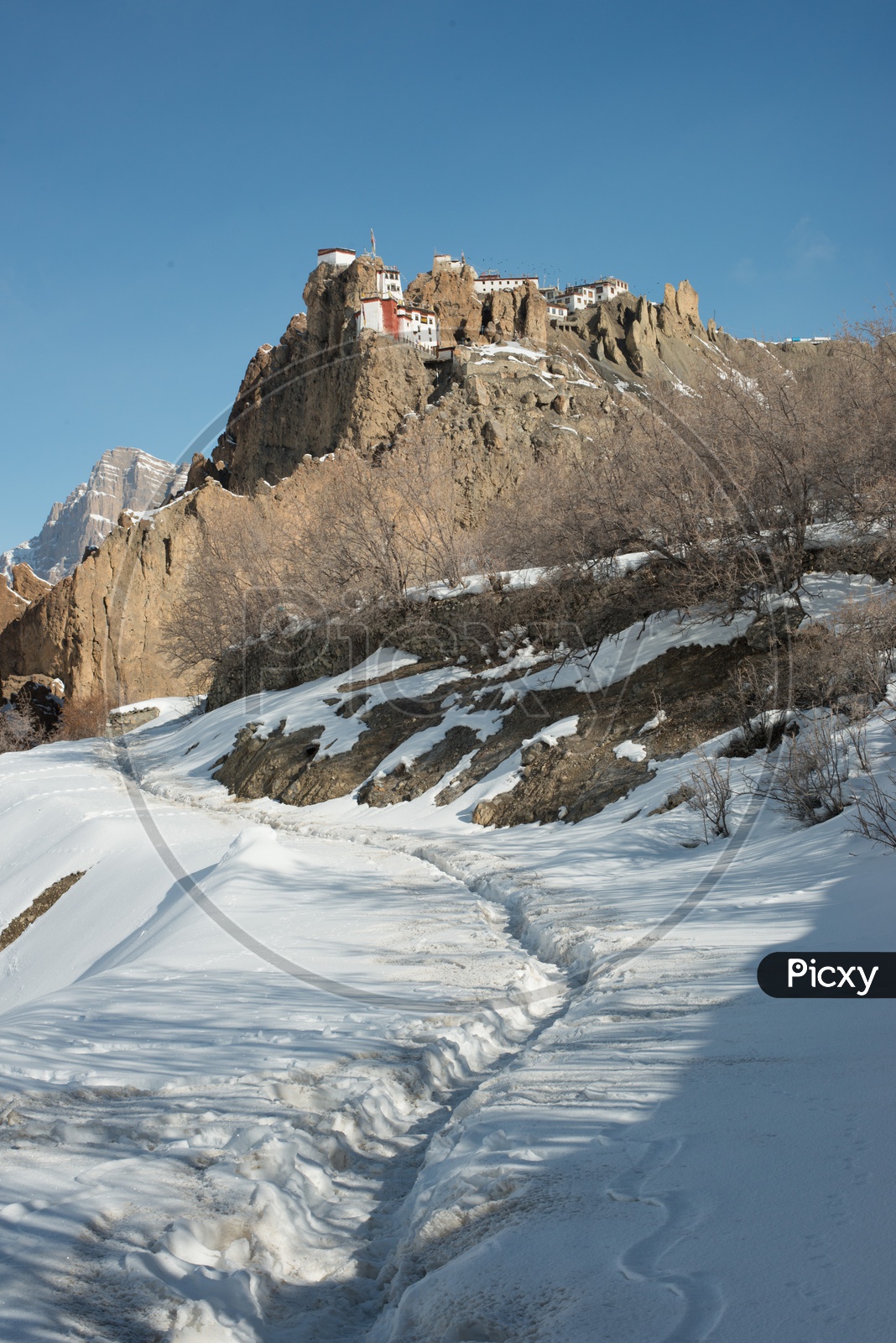 Dhankar Monastery on Mountain Top Surrounded by Snow in Winter Seasons