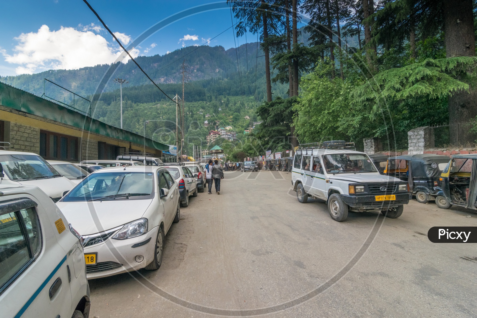 Travel Cars on Manali Road with Mountains in Background