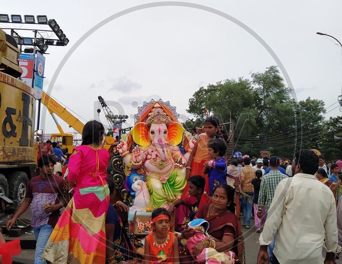 Girl and her family are out for Ganesh visargan