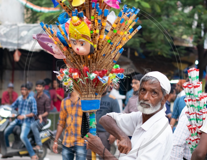 Indian Old Man Selling Flutes