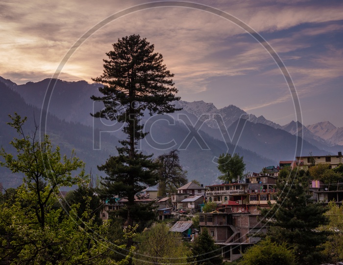 A heavenly view of himalayan village in manali during sunset