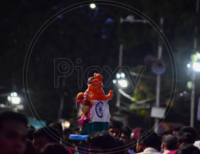 Lord Ganesh In Indian tri Colour Flag Colors Deing Carrying by Devotee