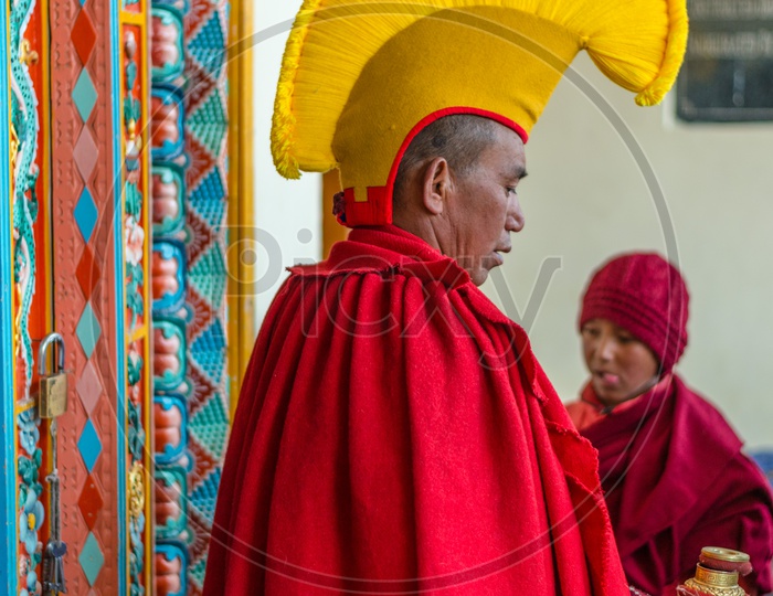 A Buddhist Monk or lama wearing a dress for the mask dance