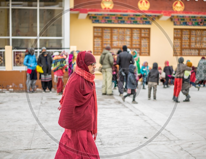 A Buddhist Lama walking in Monastery