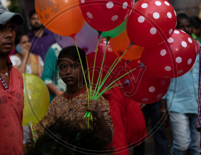 Indian Kid Selling Balloons on Street