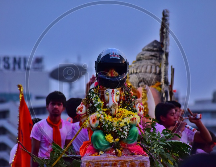 Helmet on Ganesh Idol Head During Procession On Vehicle