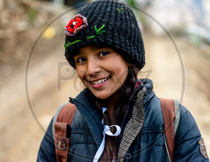 Portrait of Smiling Himachali Girl with Cap on Head