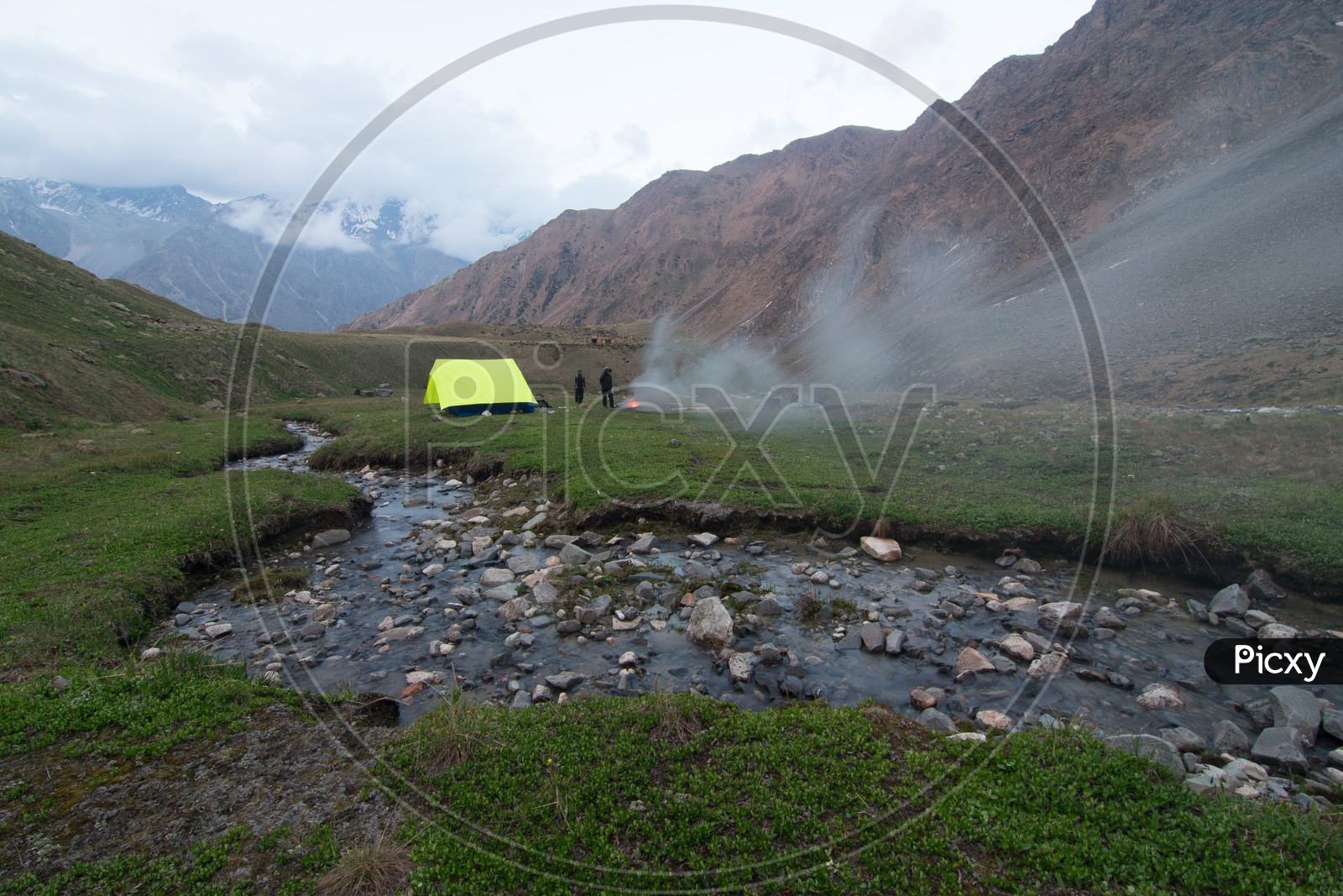 Trekkers camping point alongside a water stream