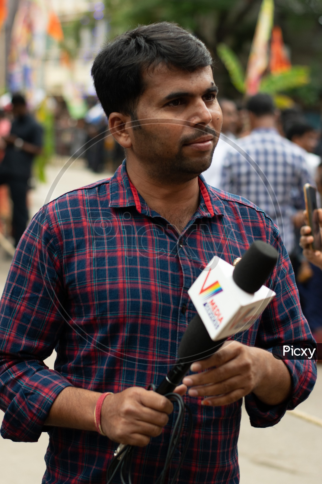 Indian Journalist with Microphone in Hand