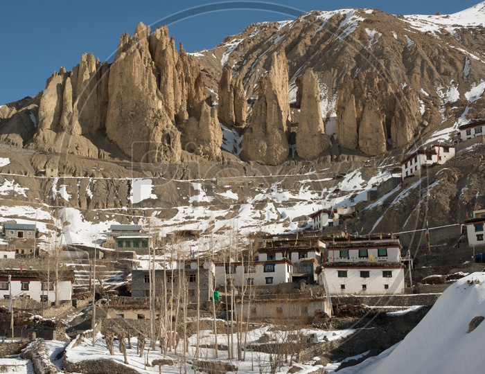 Spiti Village on Mountain in Snow with Rock Mountains in Background