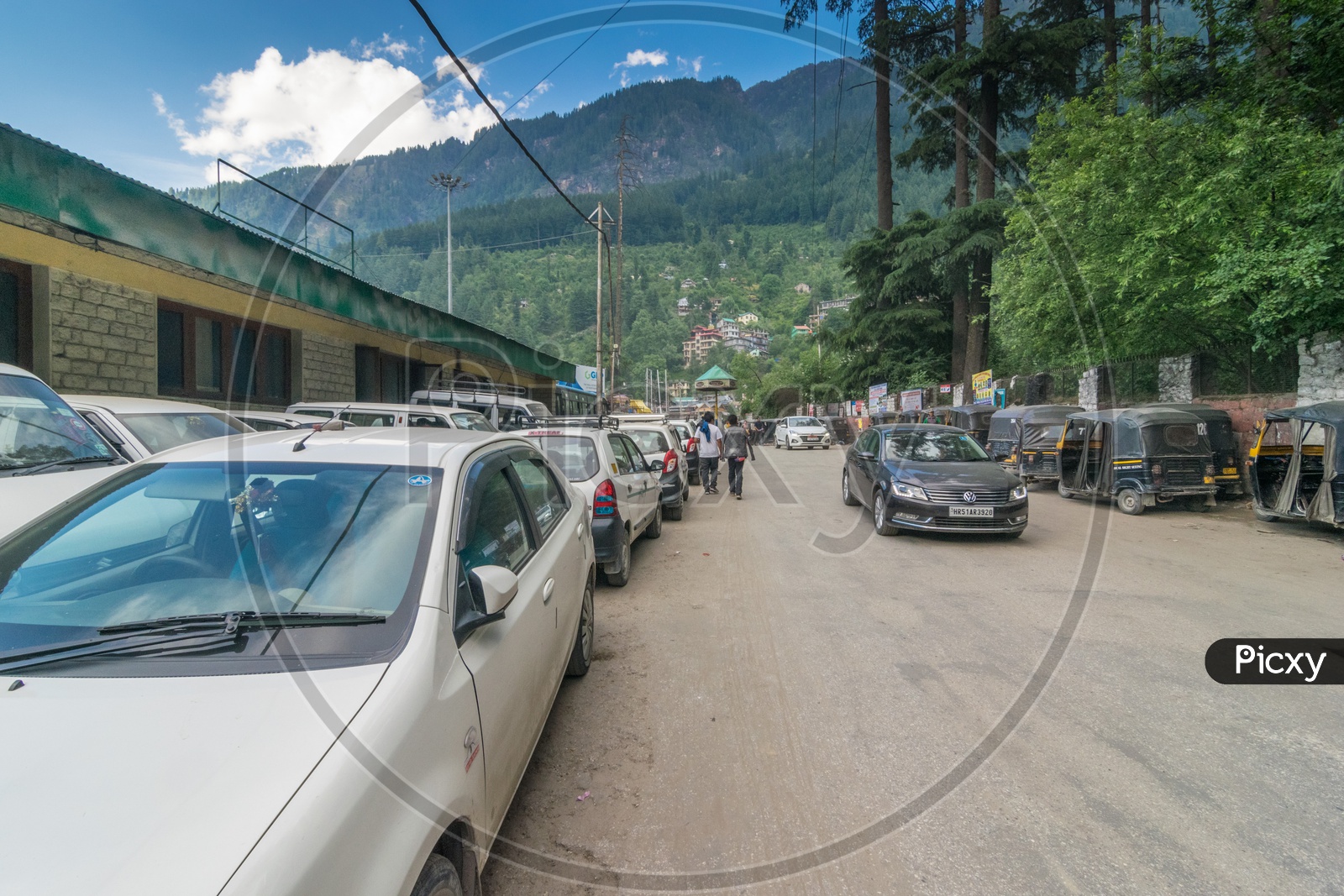 Cars on Manali Road with Mountains in Background