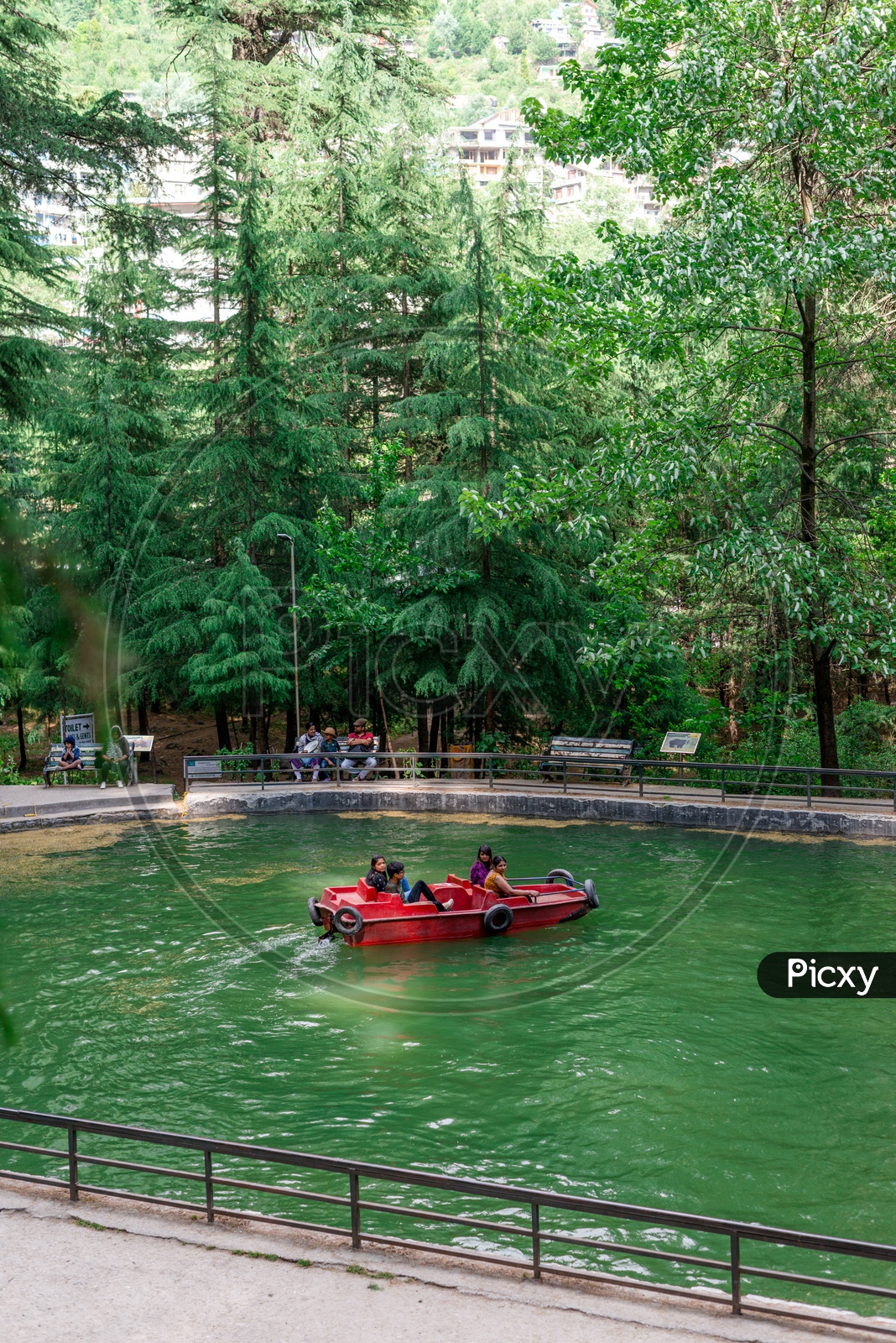 image-of-tourists-enjoying-boat-ride-in-van-vihar-national-park-at