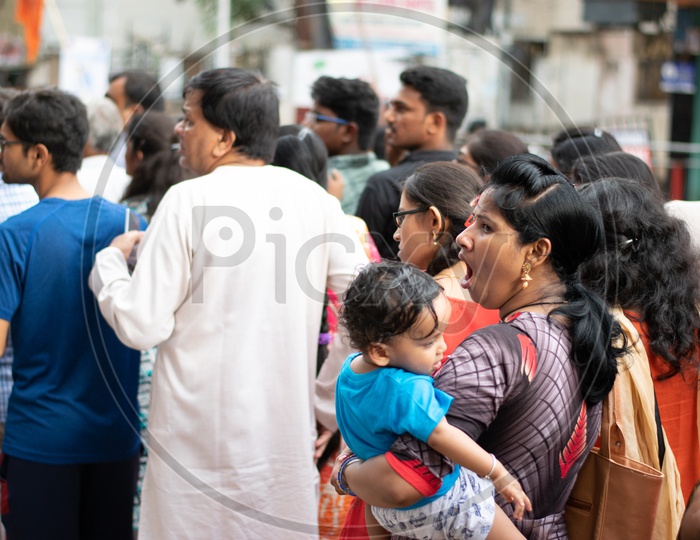 Indian mother with her little child at Khairatabad Ganesha Temple