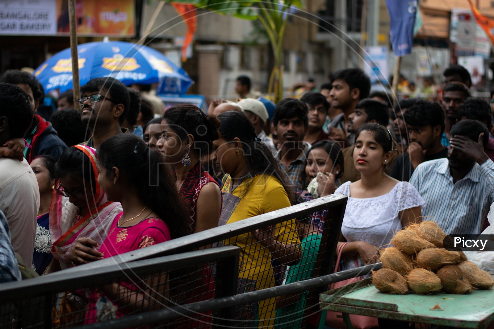 Indian Devotees in a Queue Line waiting at Khairatabad Ganesha Temple