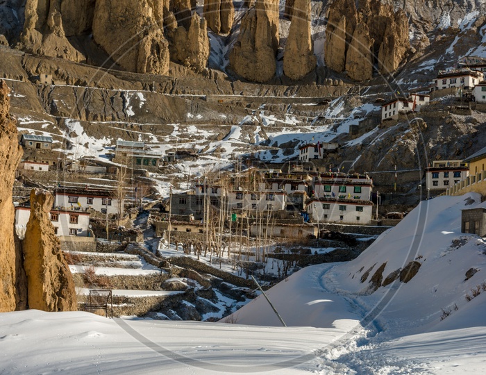 Village in Spiti on Rock Mountains Covered in Snow in Winter