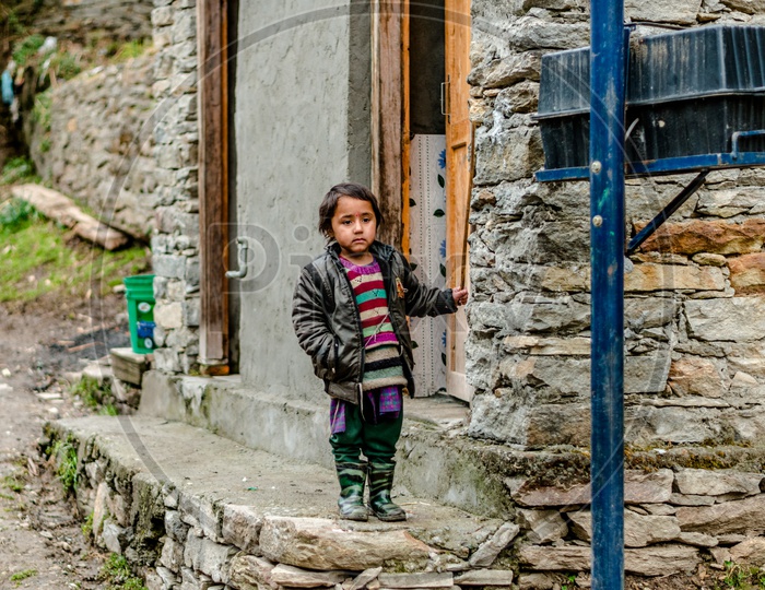 Portrait himachali girl near her house on the street in Himalayan village