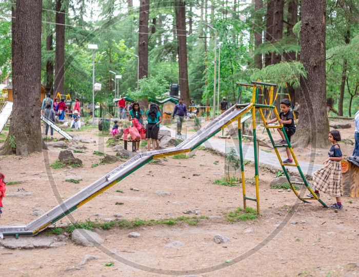 Tourists Playing on Swings in Van Vihar National Park at Manali