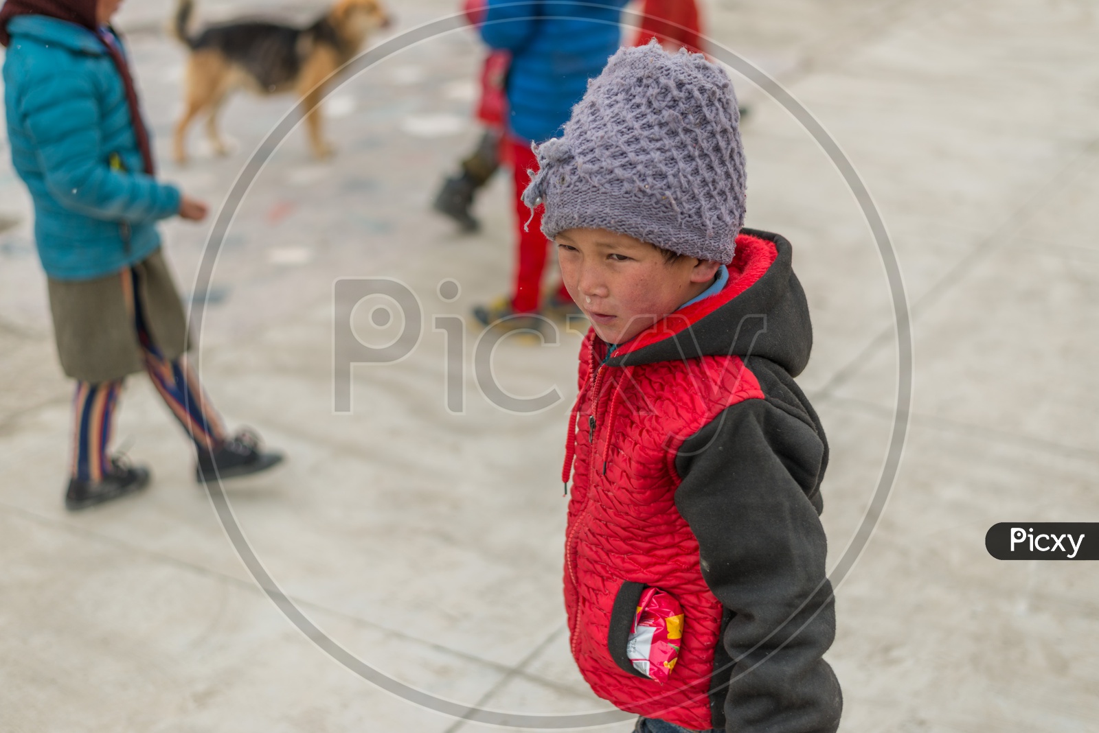 A Himalayan Kid Playing in a Monastery