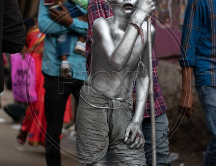 Child Beggar in Mahatma Gandhi Attire