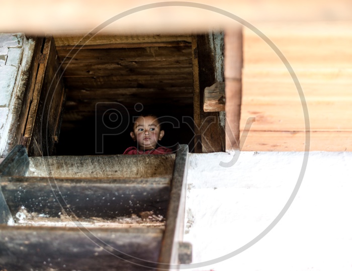 A Little Kid in House at Sainj valley