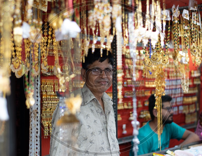 Man selling Ladies Accessories in a Shop