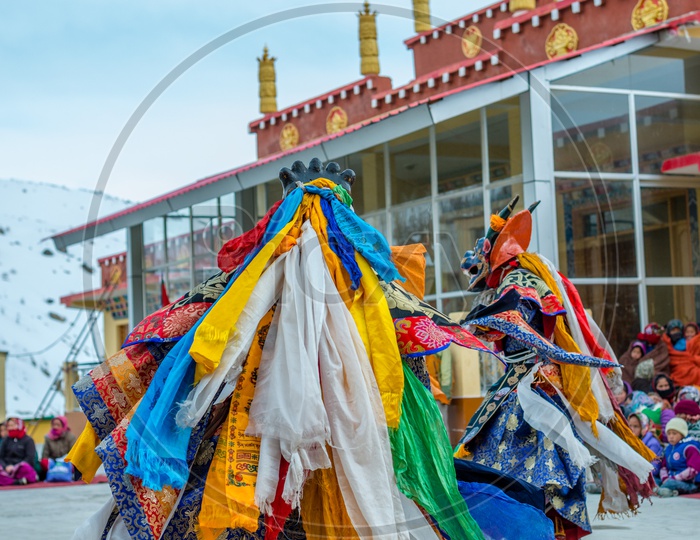 Tibetan Buddhist Lamas dressed in Mystical Mask Dance Tsam mystery in time of festival