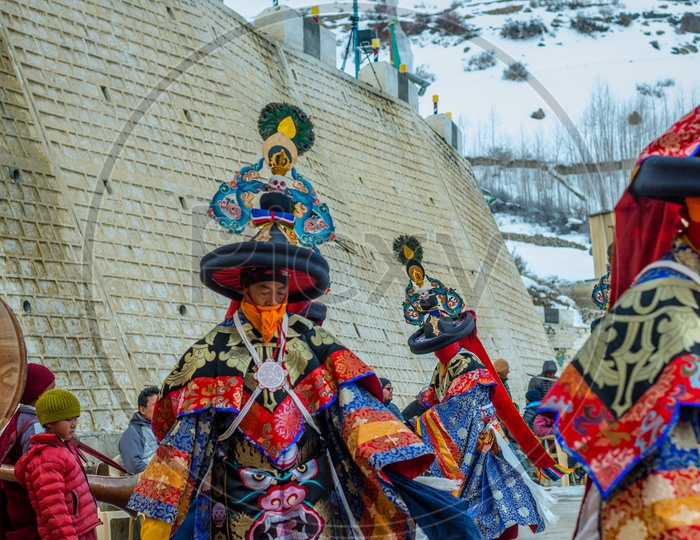 Tibetan Buddhist lamas dressed in mystical mask dance Tsam mystery