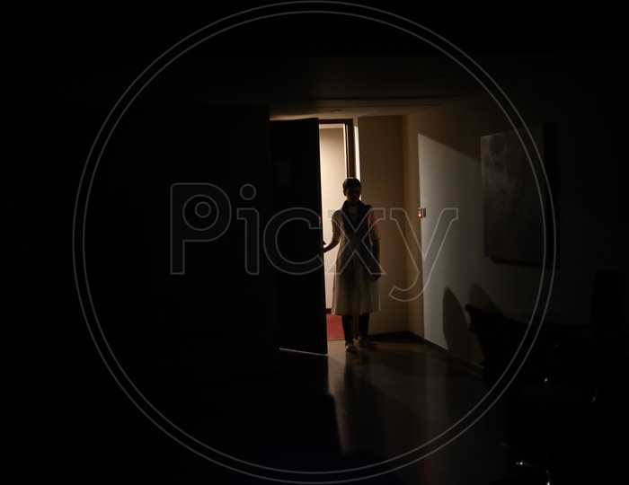 A Woman standing at the door