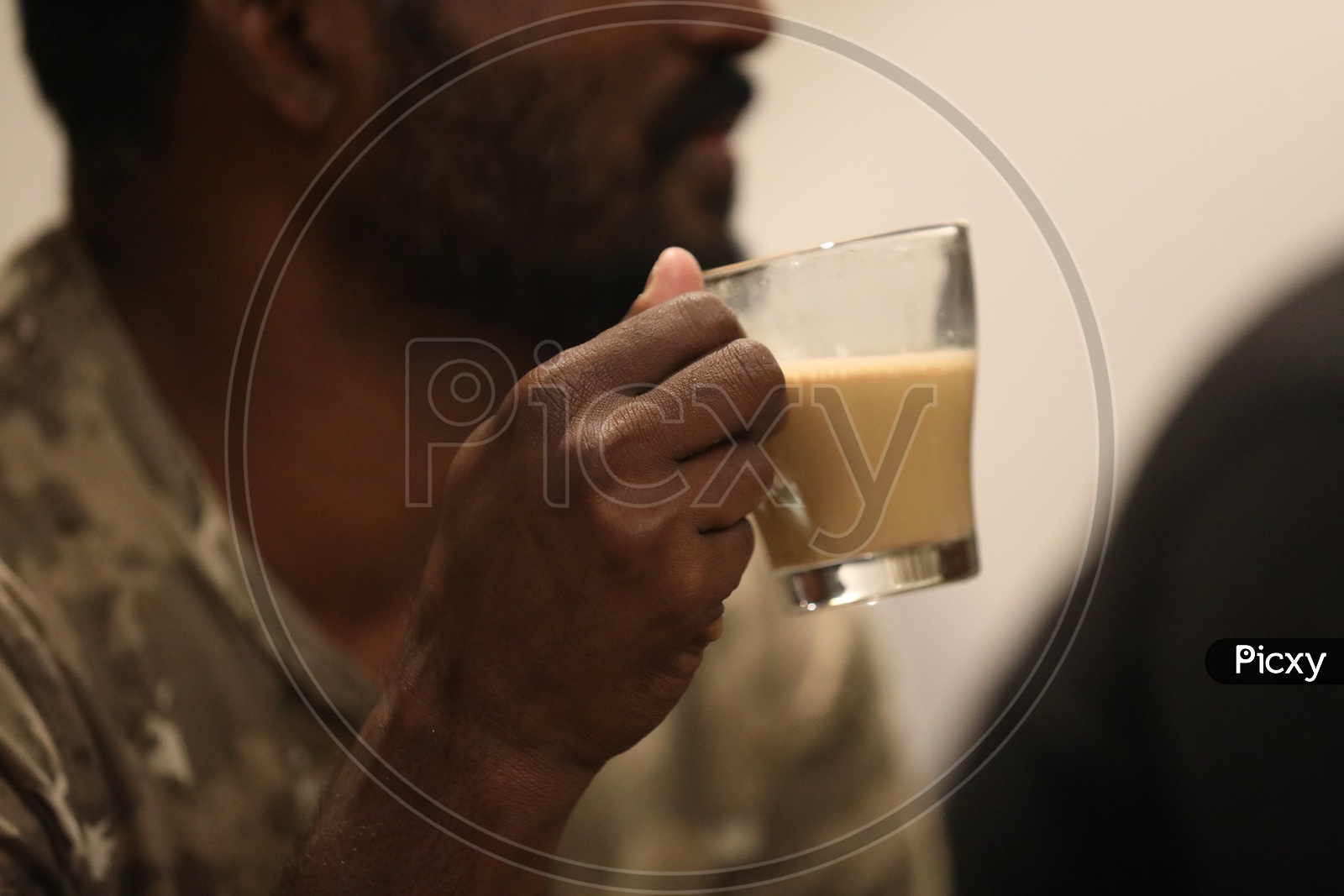 Indian Man holding a tea cup