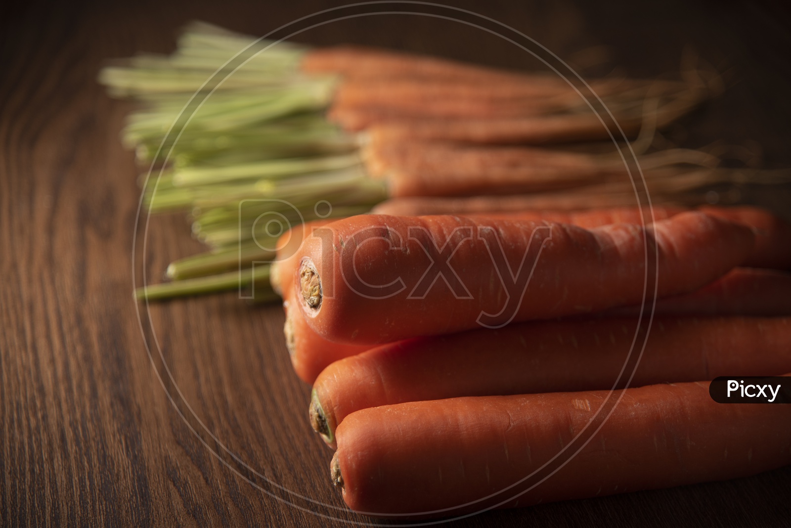 Fresh Red Carrots On Wooden Table Background