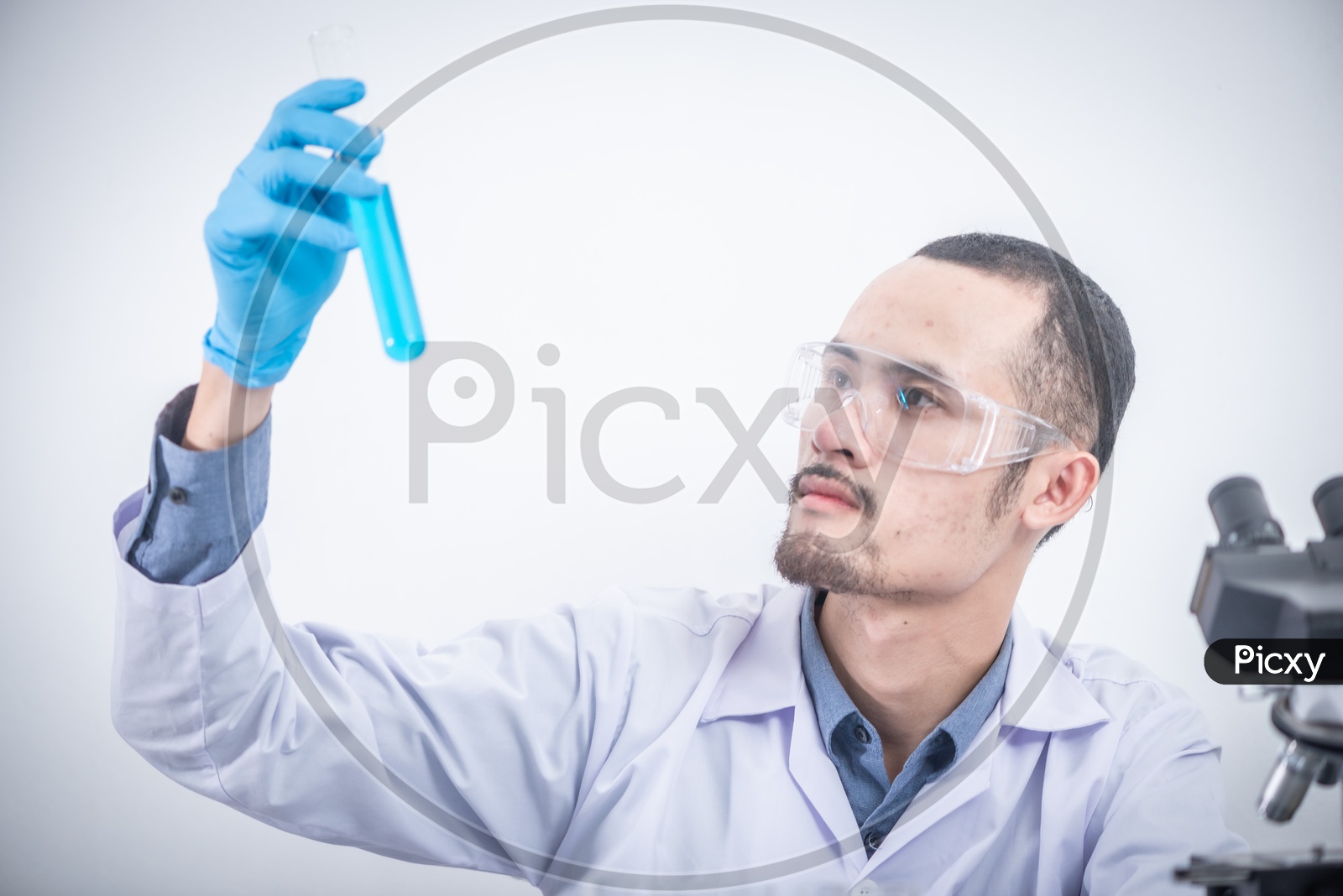 Researcher Or Scientist Testing Various Chemicals As a Part of  Research in a  Laboratory