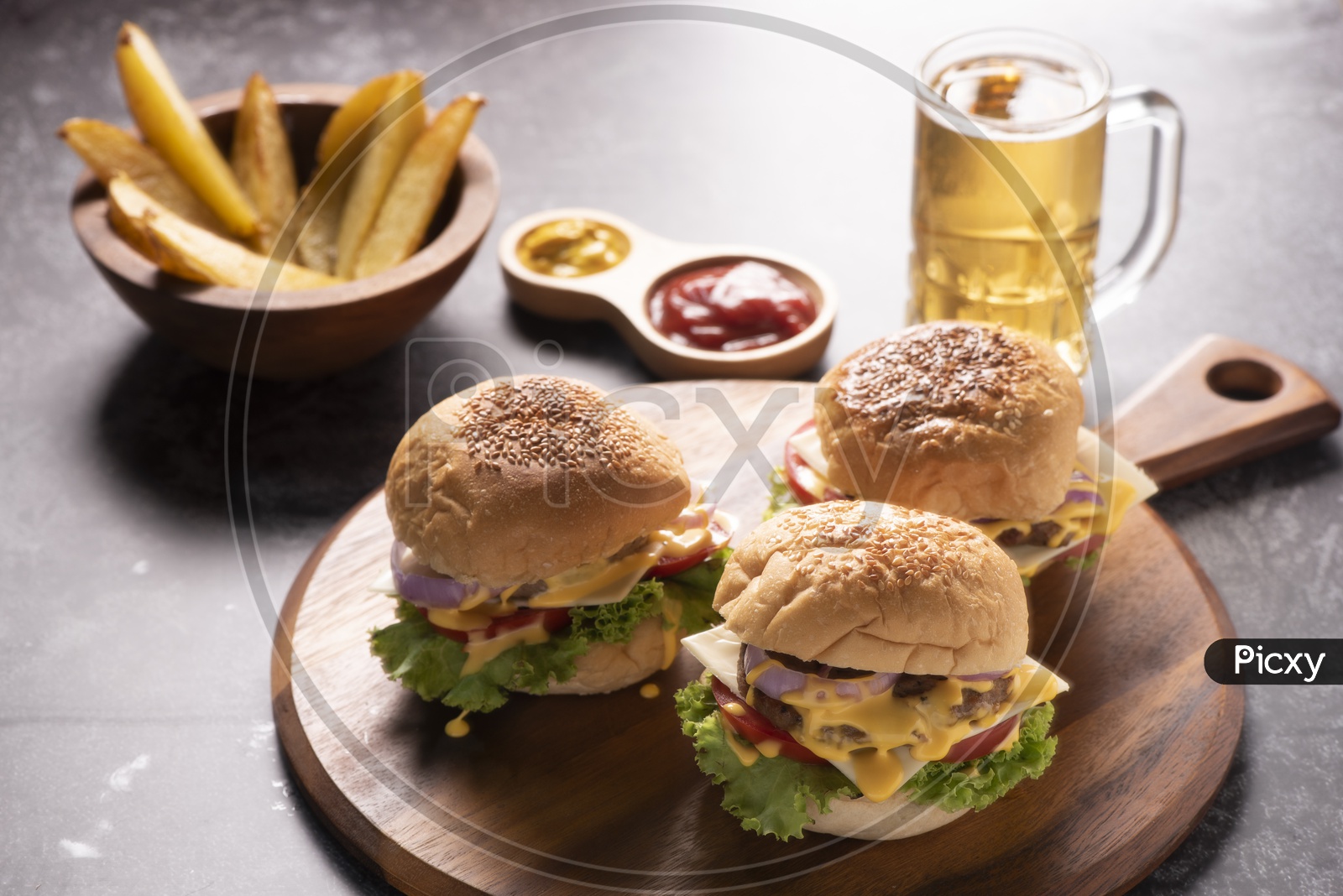 Tasty grilled home made burgers with beef, tomato, cheese, cucumber and lettuce Served With Beer and Potato Wedges