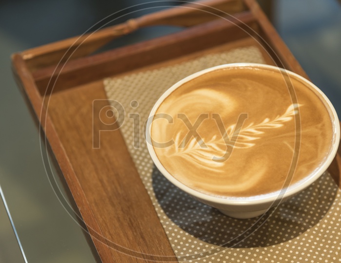Leaf Shape Coffee Latte Art  on a Cafe Table