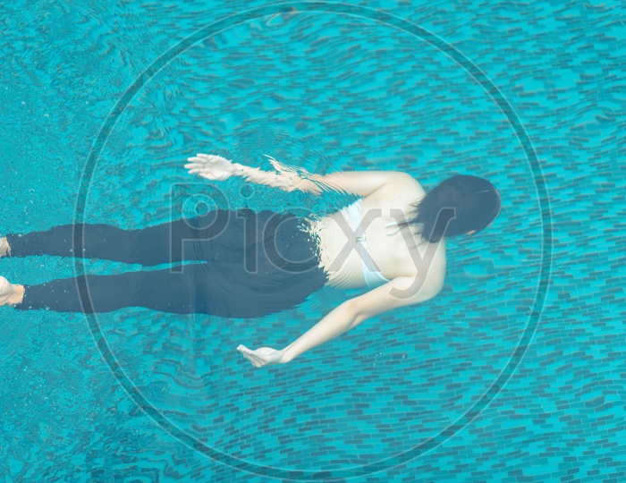 Asian girl in a Swimming pool on a  roof top