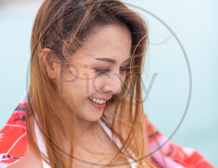Sexy Asian Model in white bikini with Streaks in her hair
