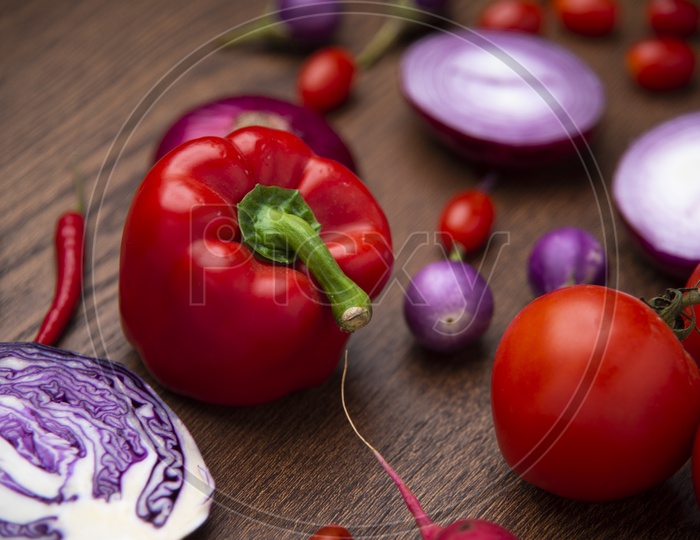 Fresh Vegetables With Bell Pepper Cabbage Onions And Tomatoes On Wooden Table Background