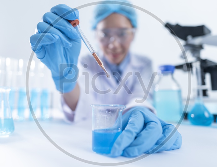 Researcher In a Laboratory Conducting Tests With Chemicals As a Part Of Cosmetics  R&D