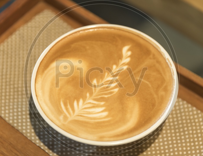 Leaf Shape Coffee Latte Art  on a Cafe Table  Closeup