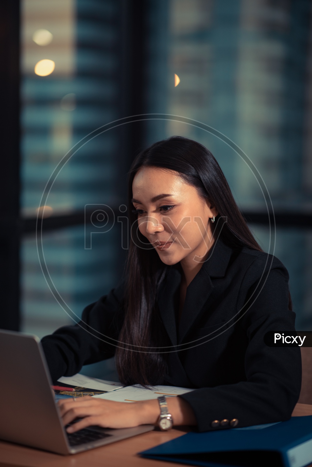 Beautiful Young Business Woman Working On Laptop At Office Desk