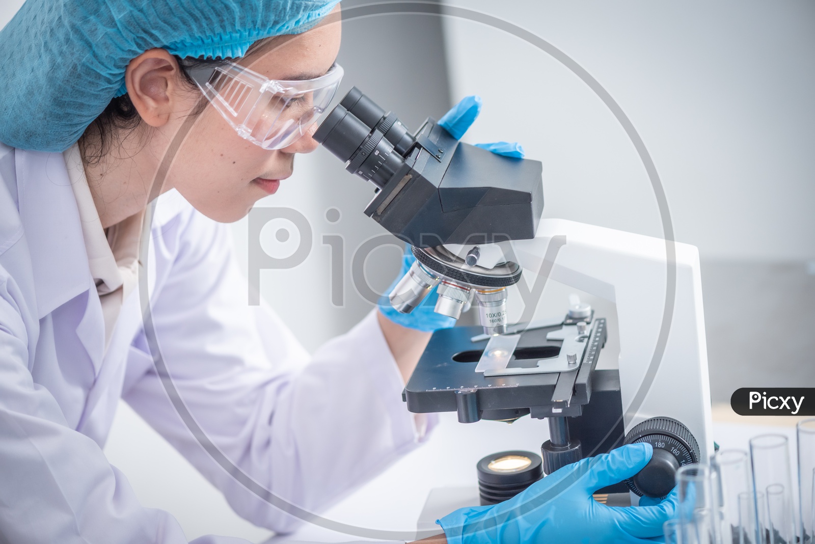Student Using Microscope in Diagnosis Laboratory