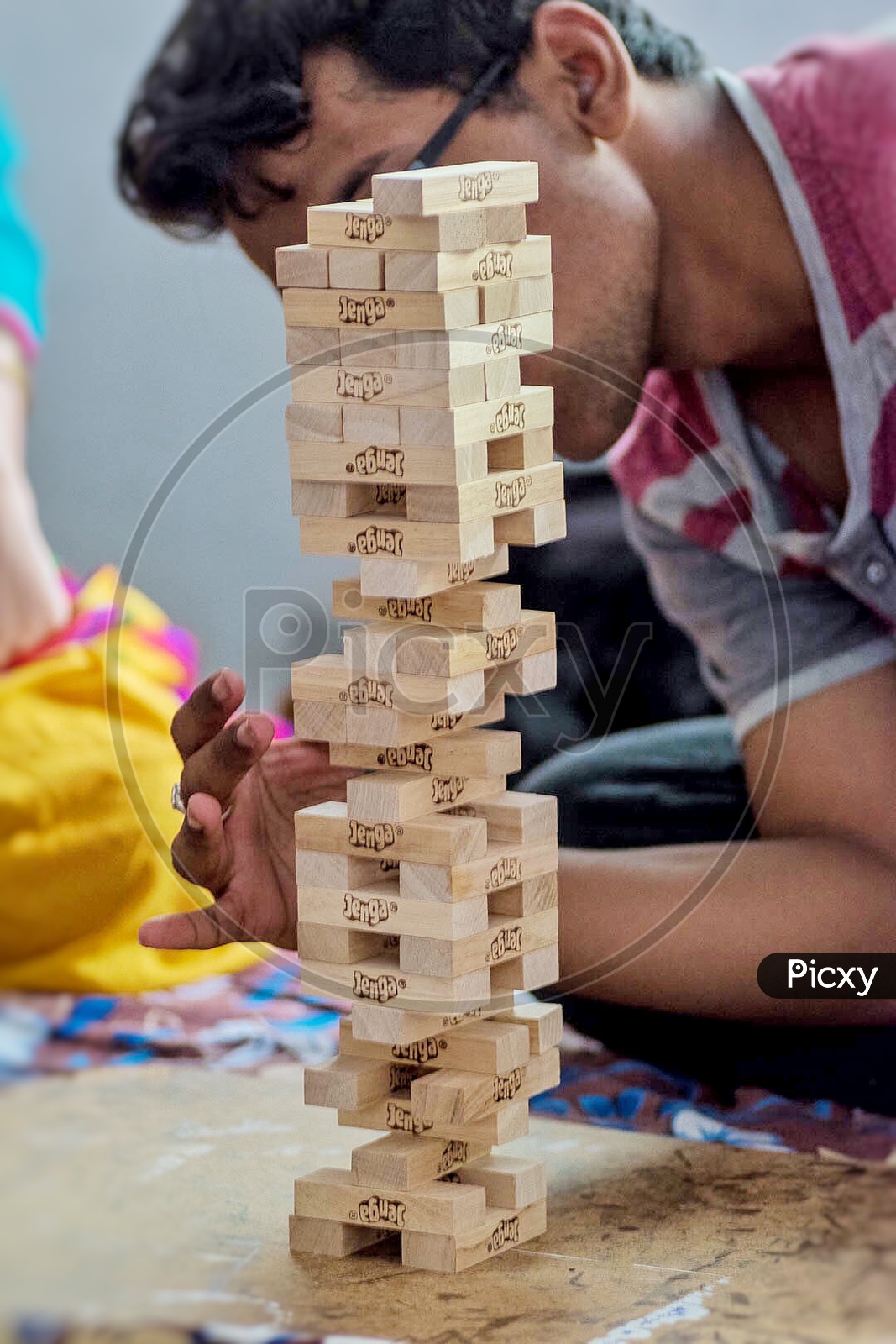 Image of Children playing indoor games Jenga blocks-SV198800-Picxy