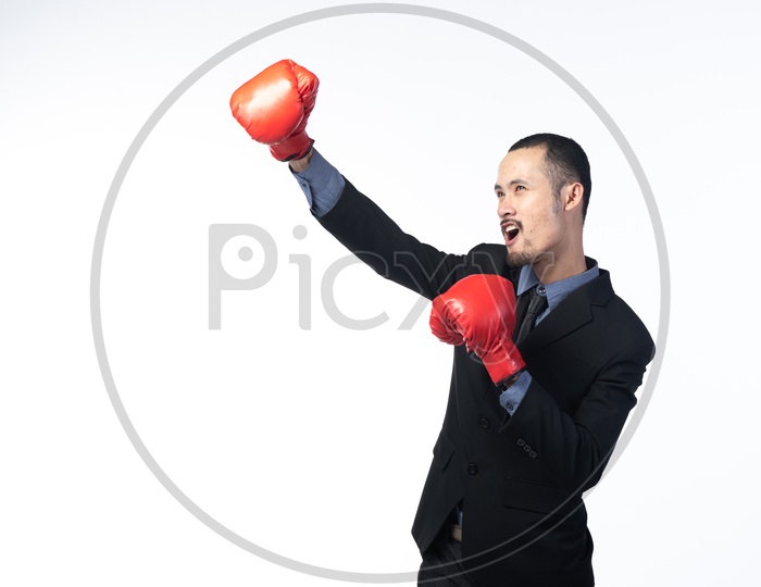 businessman with boxing gloves ,  Struggle in Business Concept