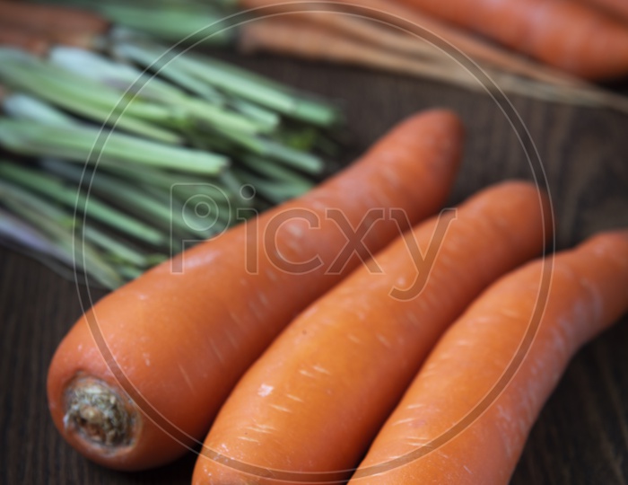 Fresh Carrots On a Wooden Table