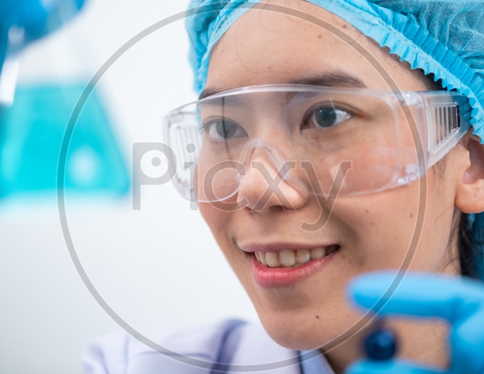 A Young Asian female scientist during the research