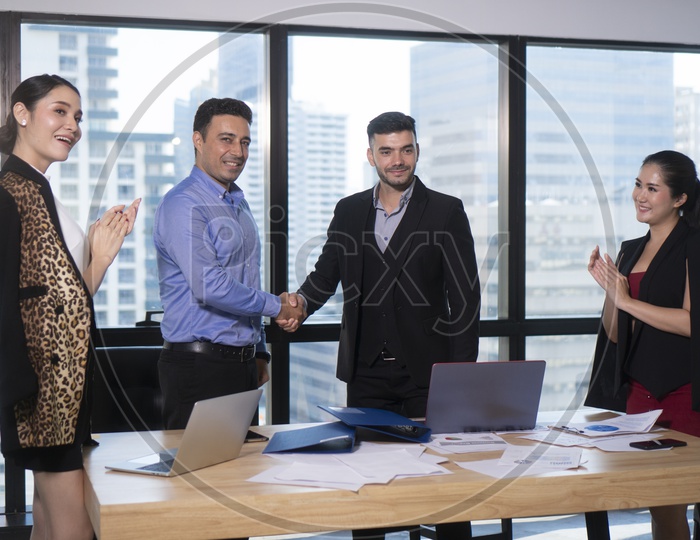Business Deals or Businessmen Shaking Hands In a Meeting
